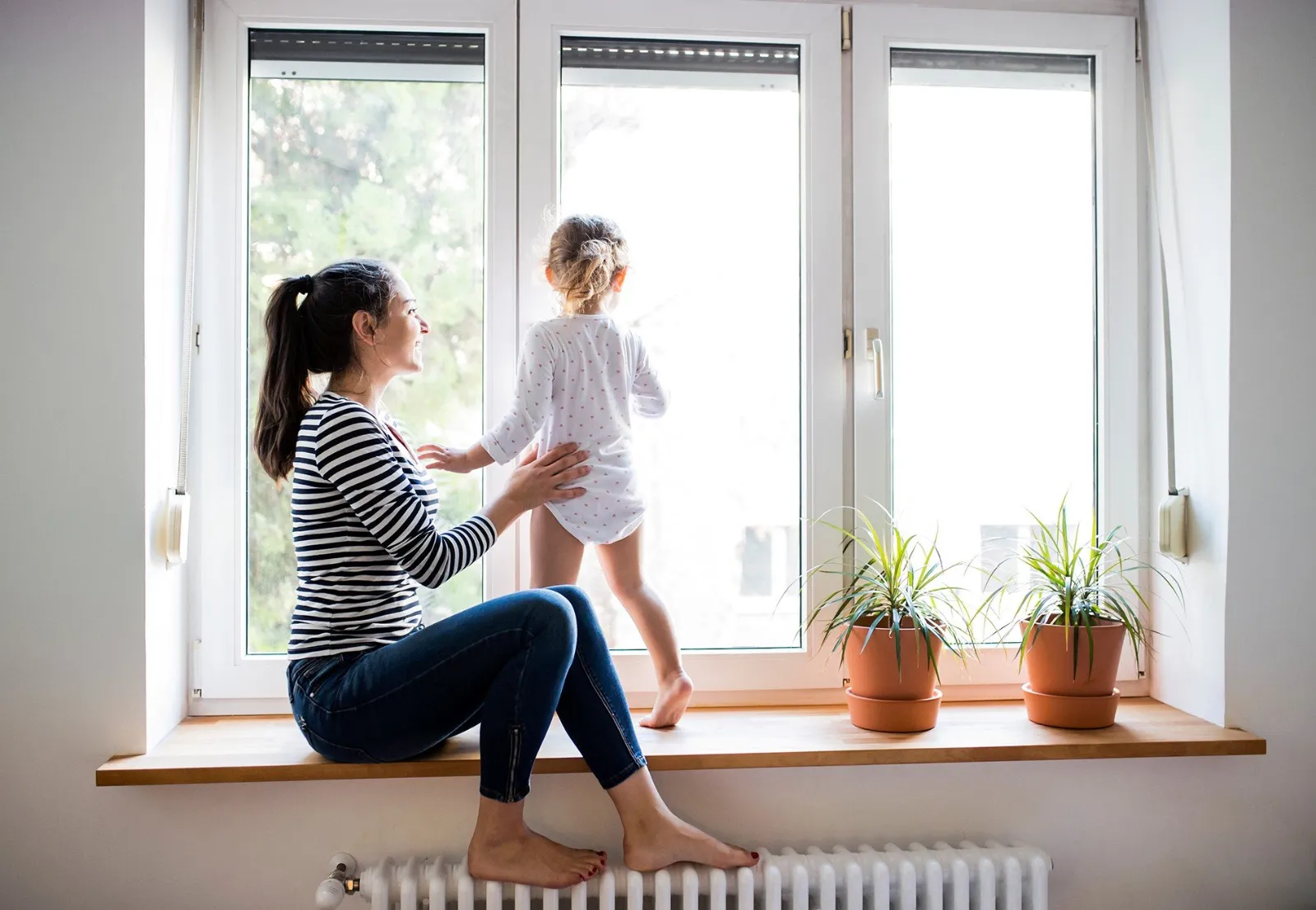 Mother and child by a sunny window