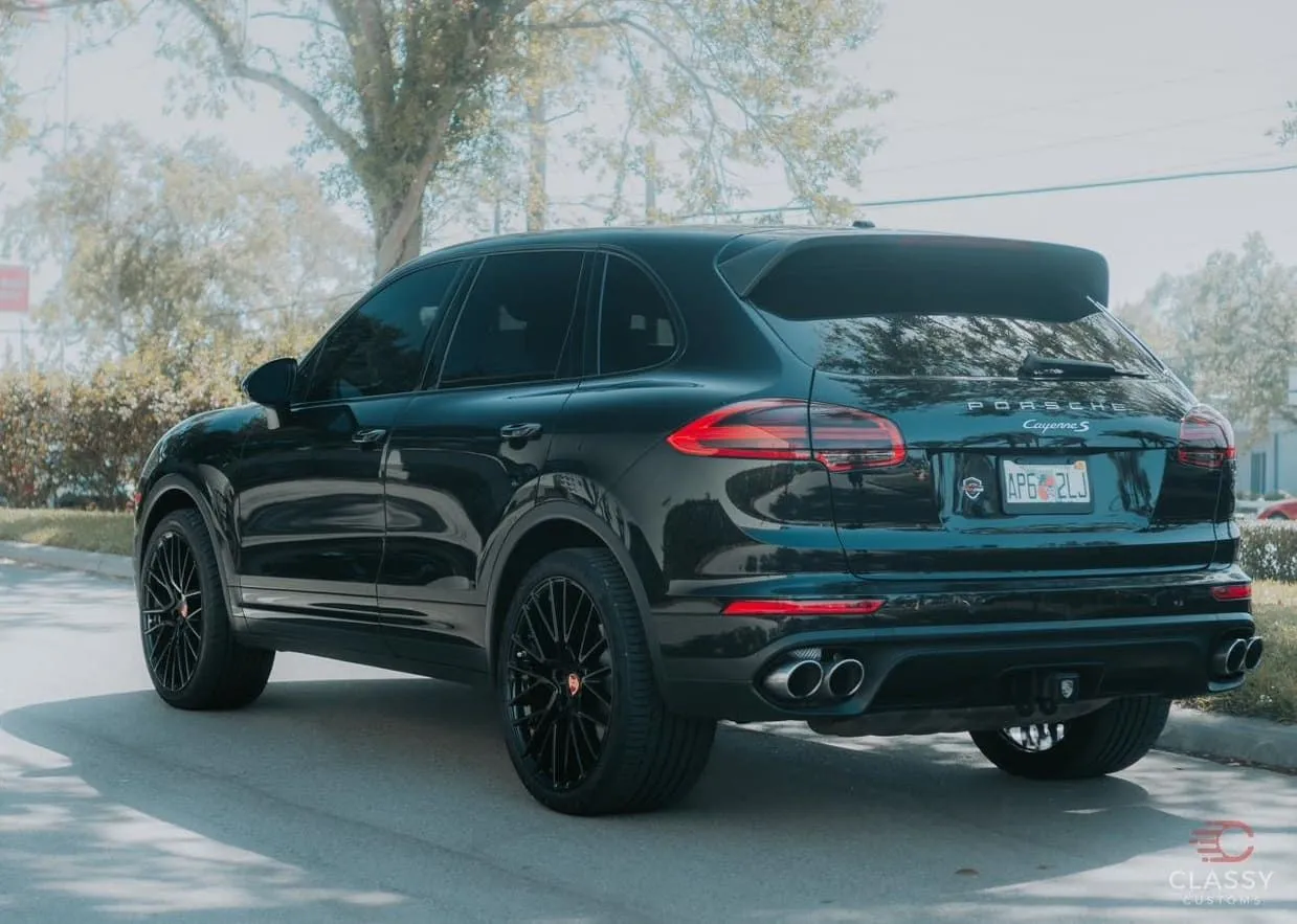 Black Porsche Cayenne with blacked-out trim
