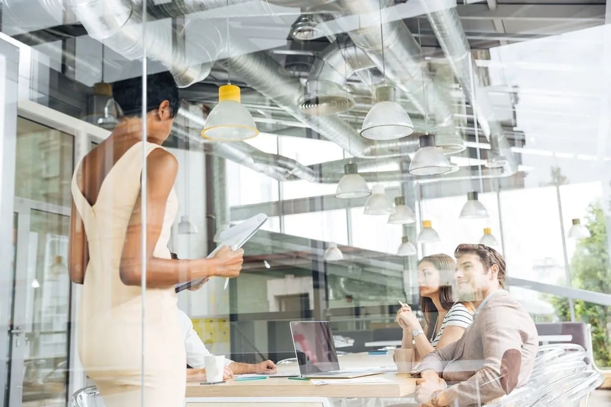 Office team working behind clear glass