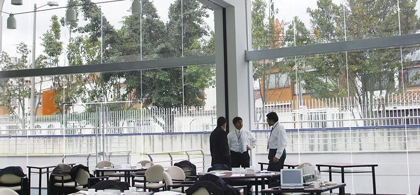 Conference area behind tall windows