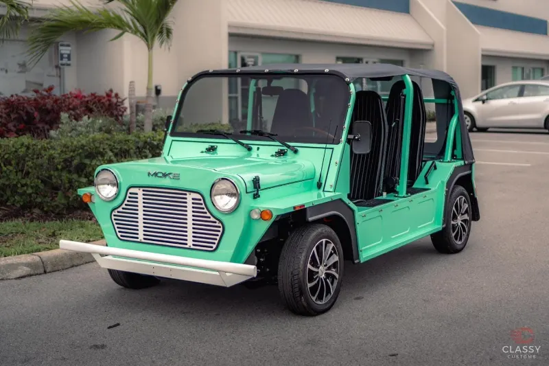 Front of a mint green Moke