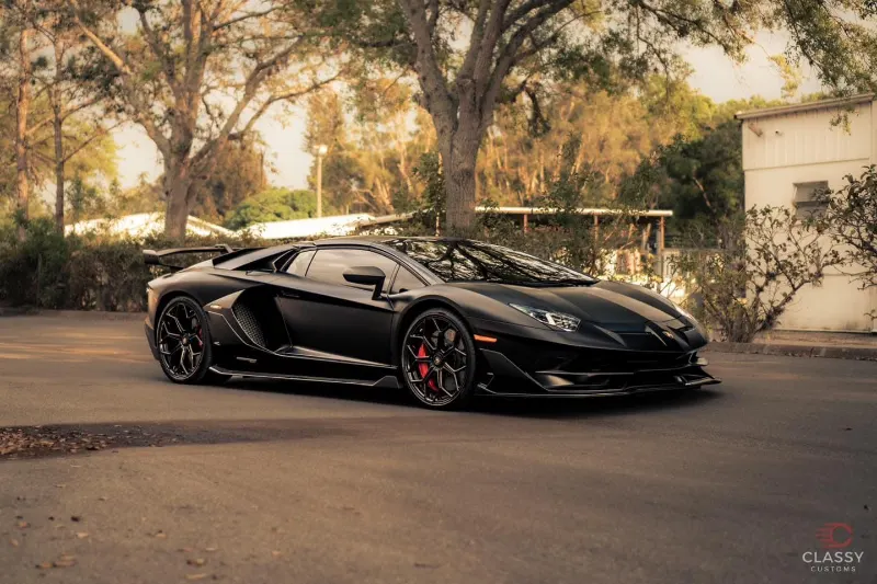 Side profile of a black Lamborghini Aventador