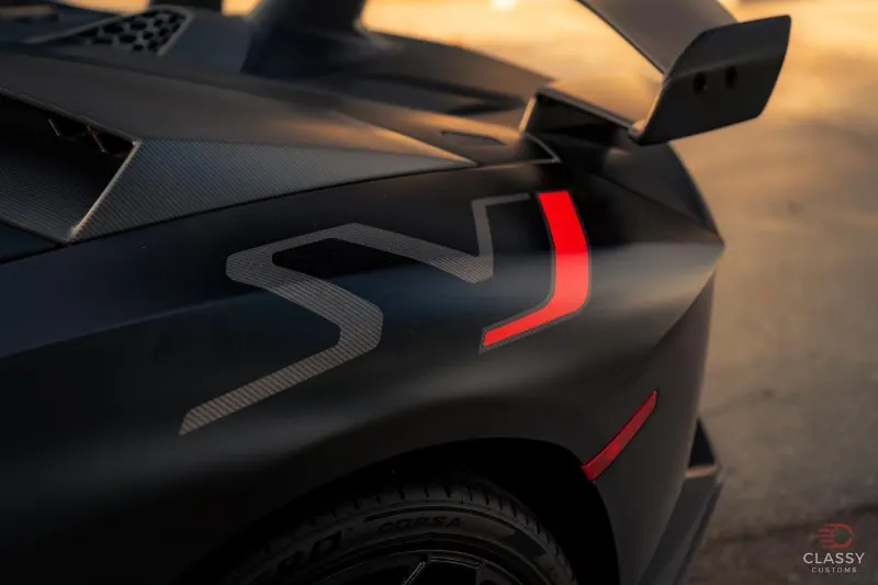 Close-up of the rear wing on a black Lamborghini