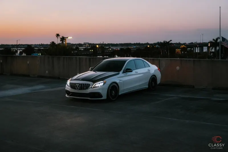 Silver Mercedes-AMG coupe at dusk