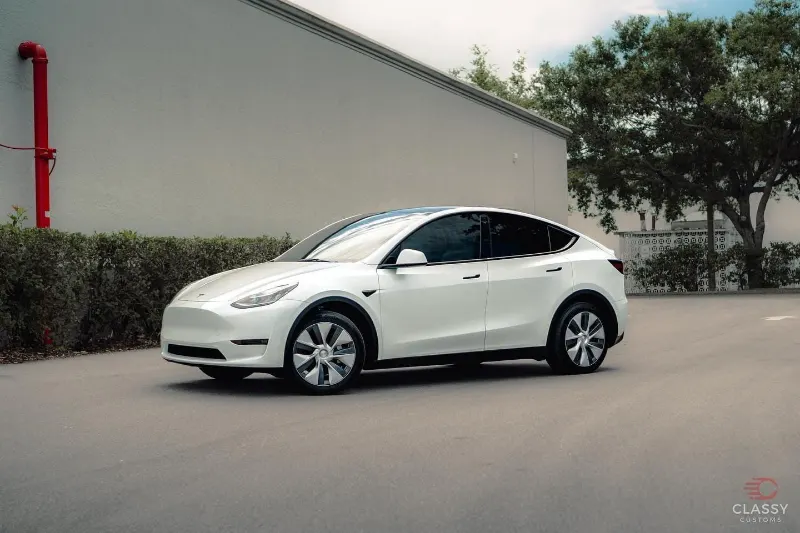 White Tesla Model Y with tinted windows
