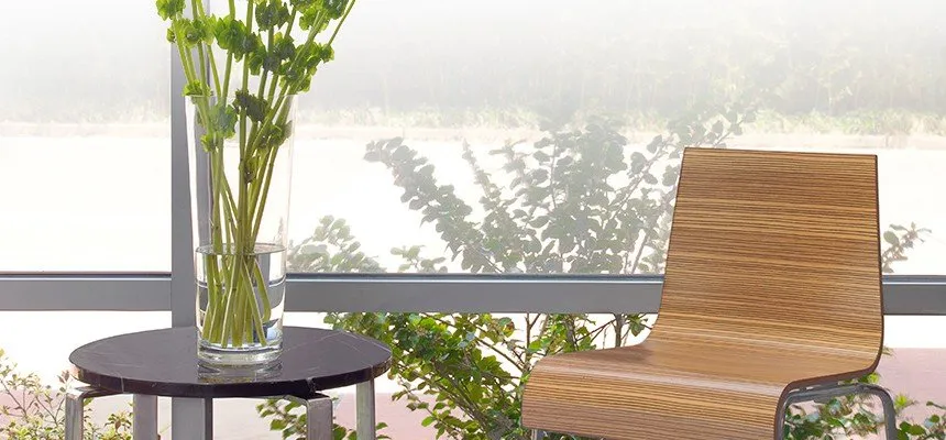 Window with gradient privacy film behind a table