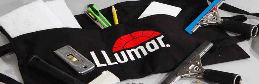 LLumar warranty materials on a dark surface