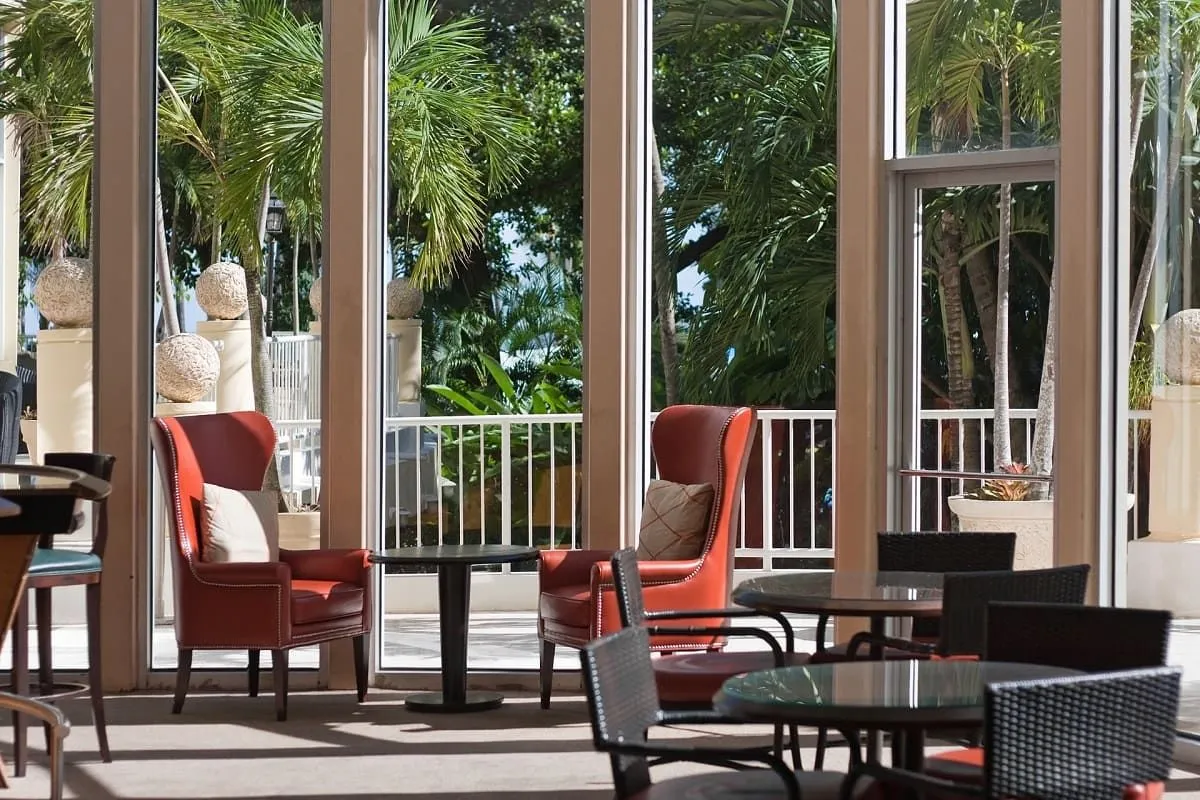 Sunroom with tall windows and lounge chairs