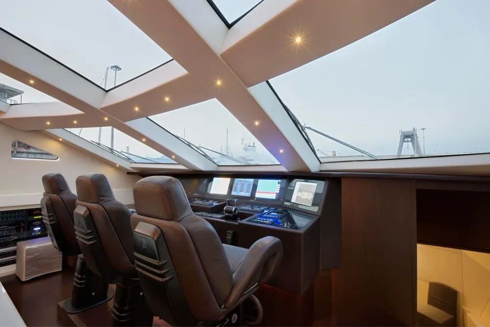 Yacht helm station with leather seats and wide windows