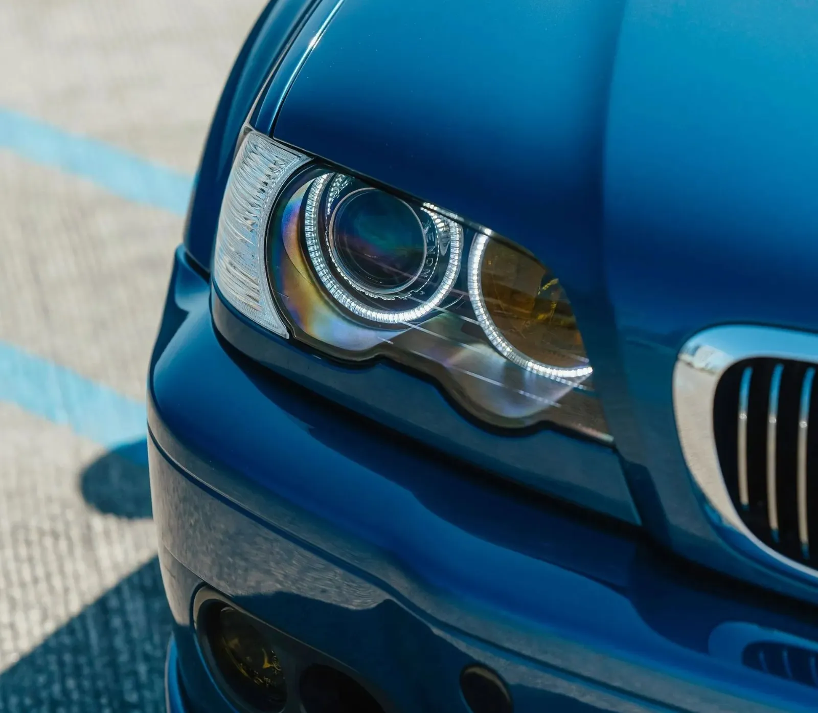 Close-up of a blue BMW headlight