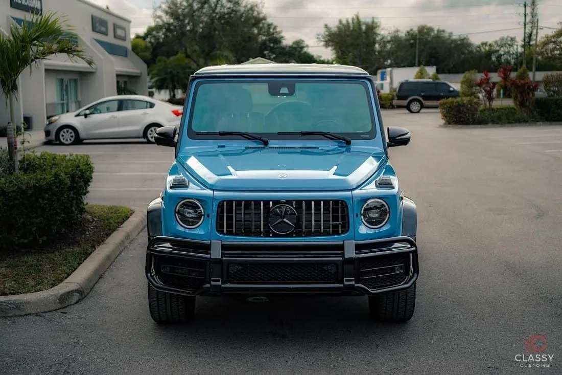 Blue Mercedes-AMG G-Class in the shop parking lot
