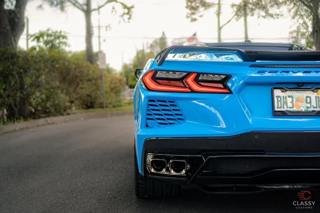 Rear view of a blue Corvette C8 with glossy paint
